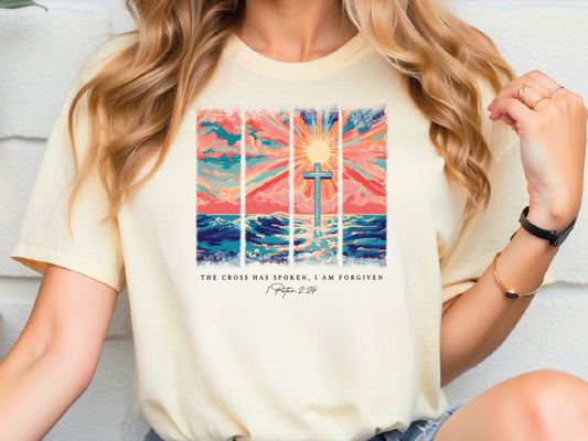 a woman wearing a t - shirt with a picture of a cross on it