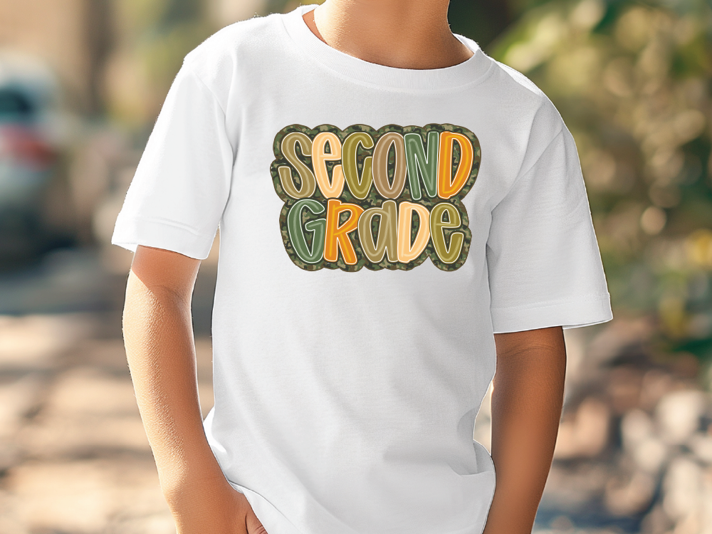 a young boy wearing a white shirt with the words second grade printed on it