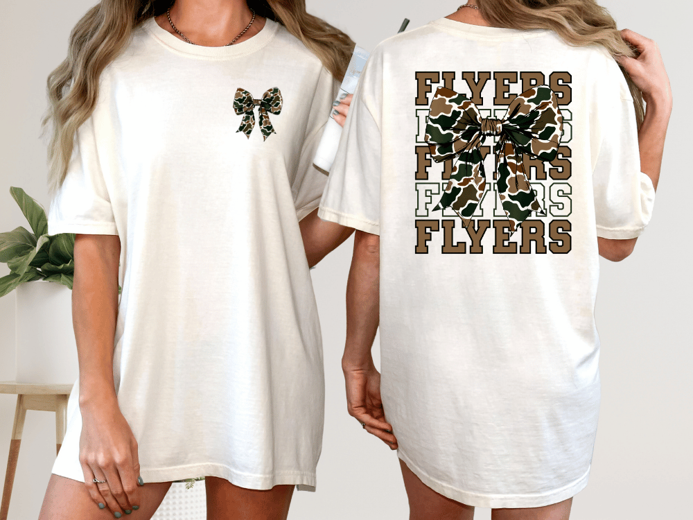 A woman wearing a white t-shirt with a large bow on the front and the word "FLYERS" printed on the back.