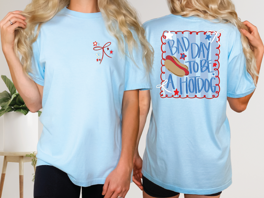 a woman wearing a blue shirt with a hot dog on it