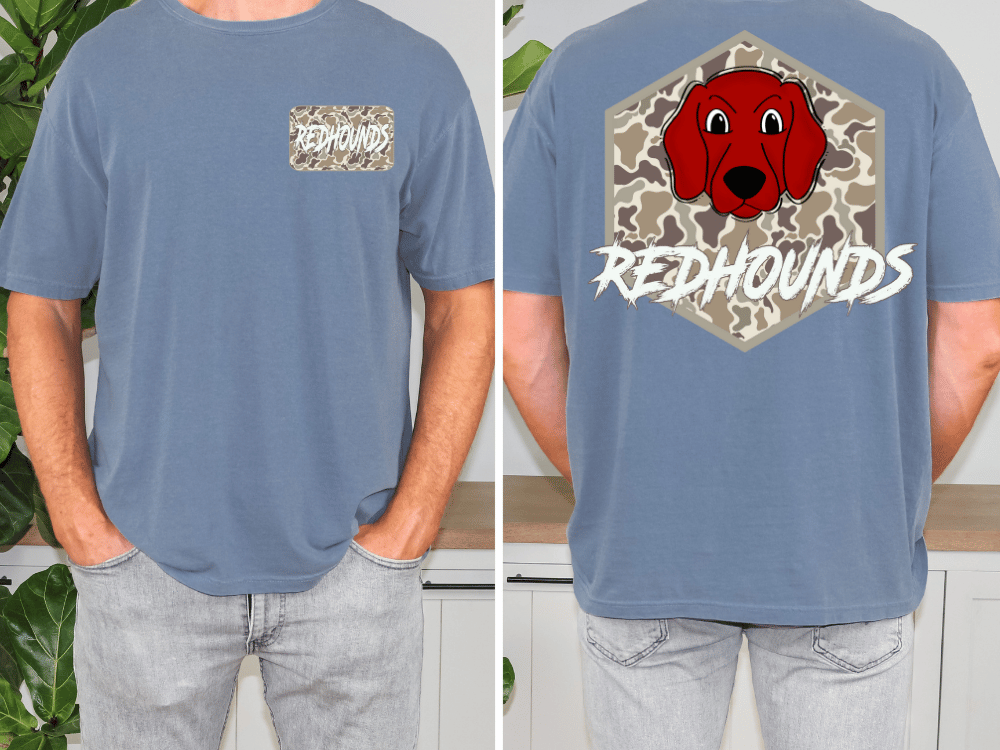 a man wearing a blue t-shirt with a graphic of a red dog's face and the text "REDHOUNDS" printed on the back.