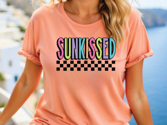 a woman wearing a pink shirt that says sunkseed