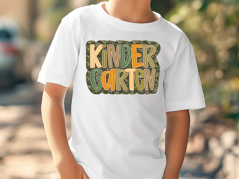 a young boy wearing a white t - shirt with the words kinder garden on