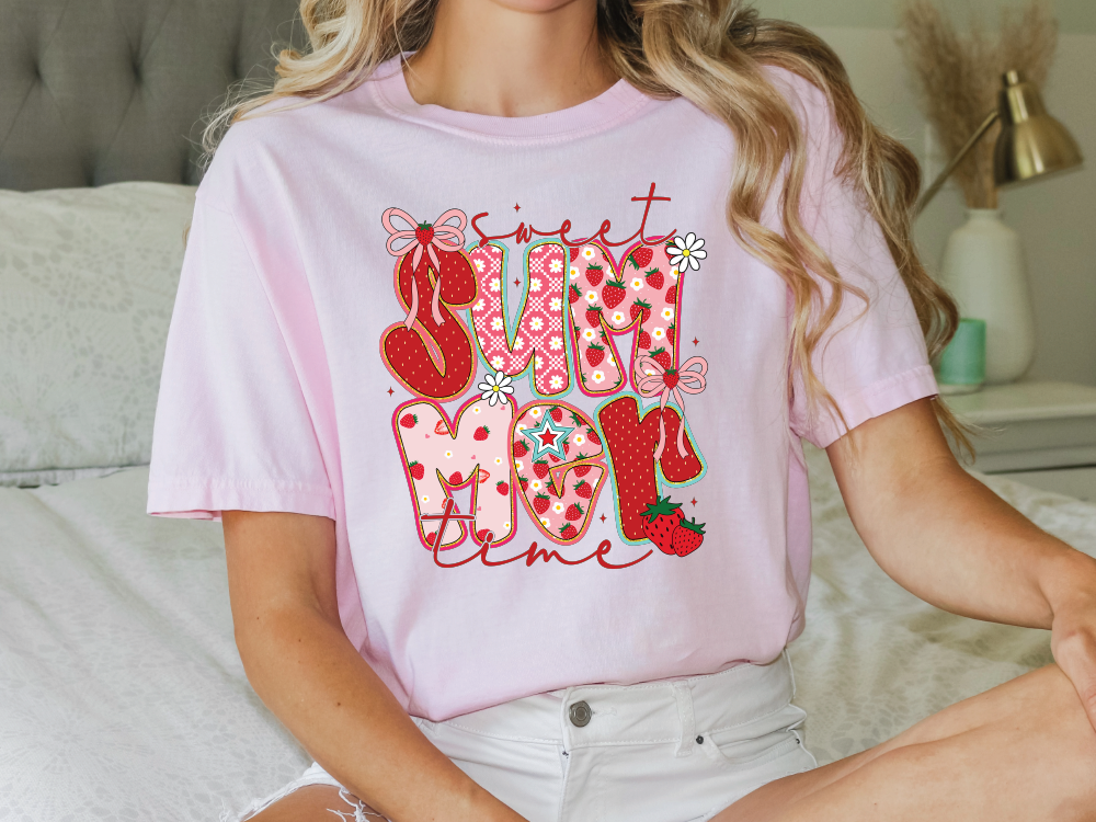 a woman sitting on a bed wearing a pink shirt