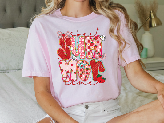 a woman sitting on a bed wearing a pink shirt