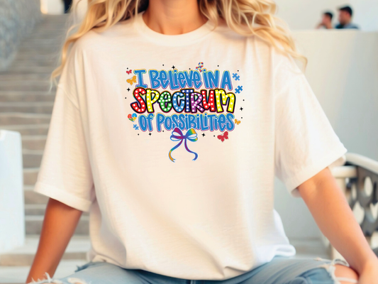 a woman wearing a white t - shirt with the words i believe in a special