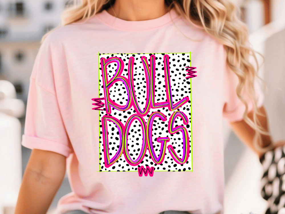 A woman wearing a pink t-shirt with the text "Bull Dogs" printed on it.