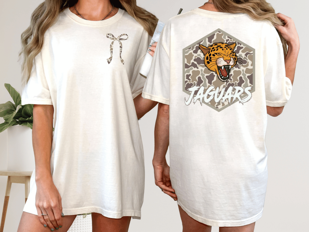 two different views of a white t-shirt with a graphic design on the back. The design features a jaguar's head with a bow on the left side and the word "JAGUARS" written on the right side.