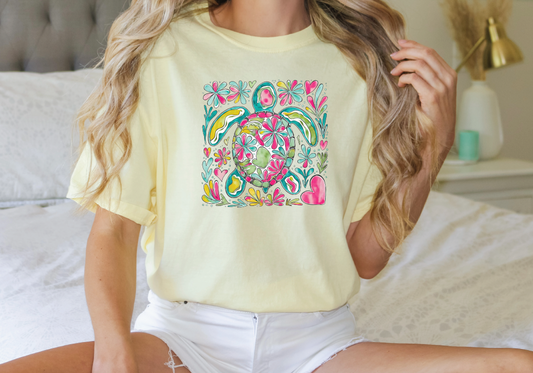 a woman sitting on a bed wearing a yellow shirt