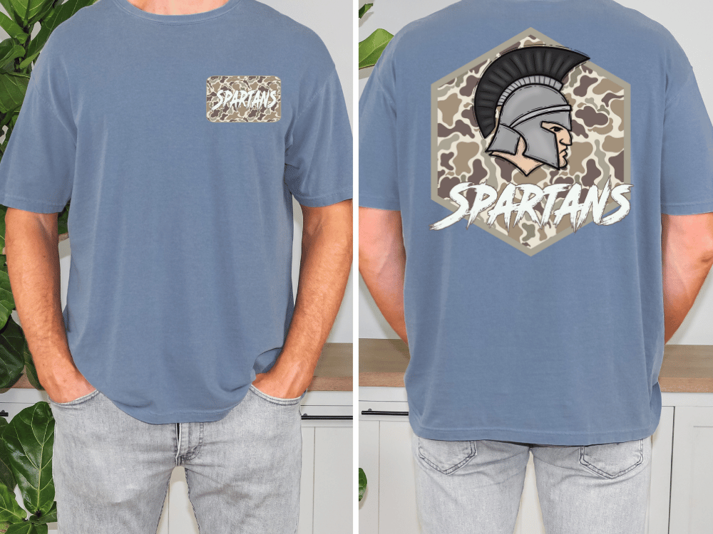 a man wearing a blue t-shirt with a graphic design on the back. The design features a helmet with a plume and the word "SPARTANS" written below it.