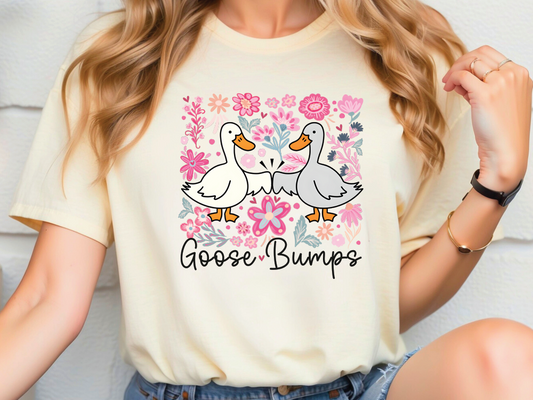 a woman wearing a t - shirt that says goose bumps