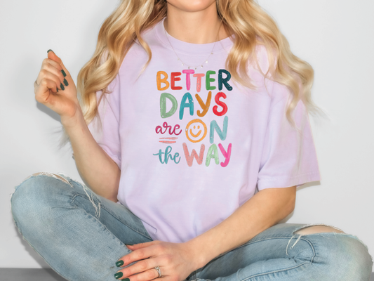 a woman sitting on the floor wearing a t - shirt that says better days are