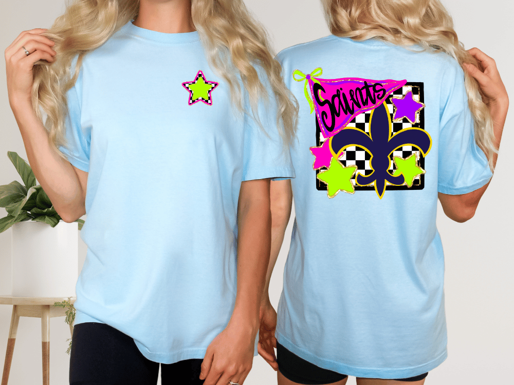 two women wearing light blue t-shirts with colorful designs on the back.