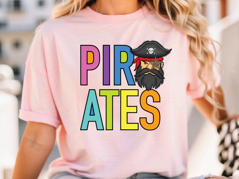 A woman wearing a pink t-shirt with the text "PIRATES" and a cartoon pirate character on it.
