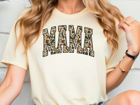a woman wearing a shirt that says mama on it