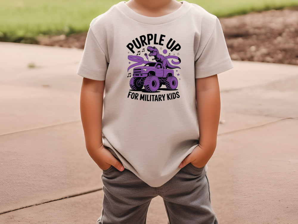 a young boy wearing a t - shirt that says purple up for military kids
