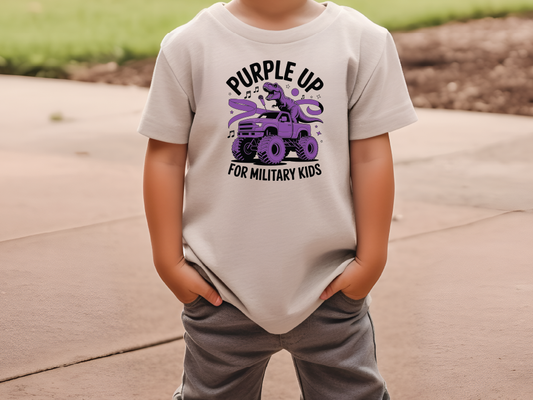 a young boy wearing a t - shirt that says purple up for military kids