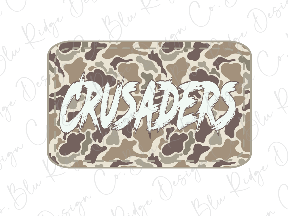 A camouflage-patterned rectangular object with the word "CRUSADERS" written in a stylized, distressed font.