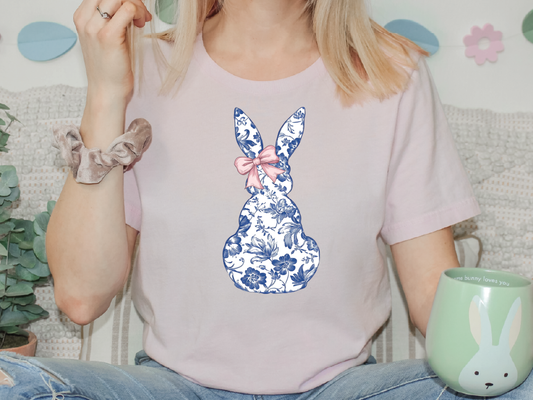 a woman sitting on a couch holding a cup