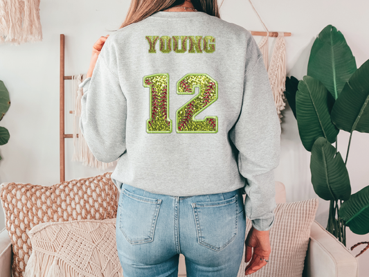 a woman wearing a sweatshirt with the number 12 on it