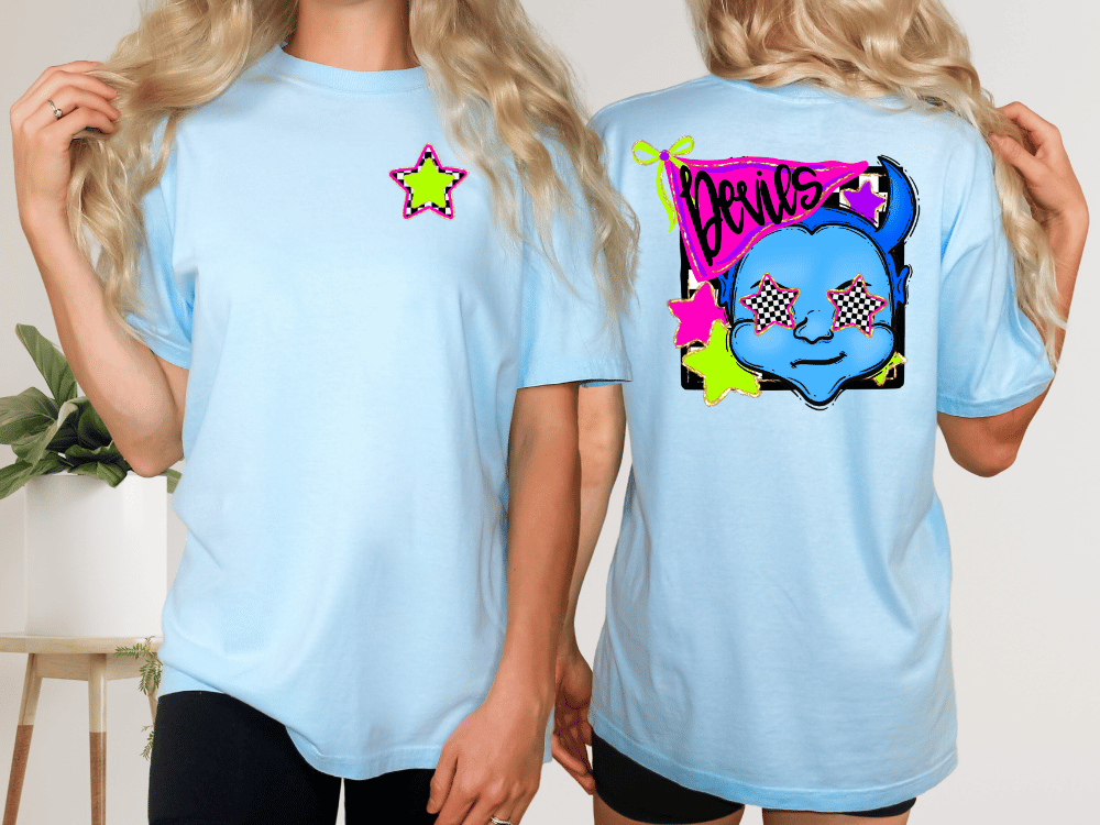 two women wearing light blue t-shirts with colorful designs on the back.