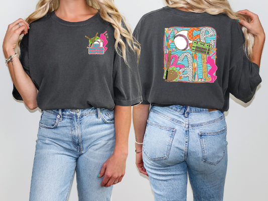 two women wearing black t - shirts with colorful designs on them