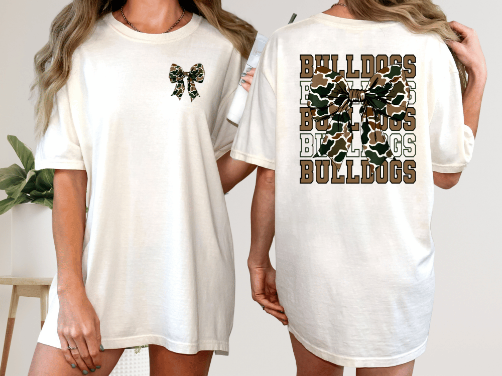 A woman wearing a white t-shirt with a camouflage pattern and the text "Bulldogs" printed on the back.