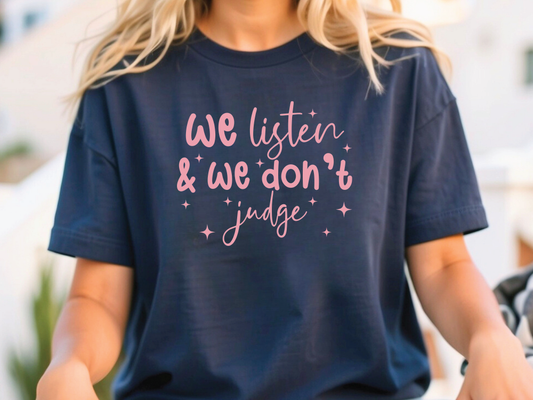 a woman wearing a t - shirt that says we listen and we don't