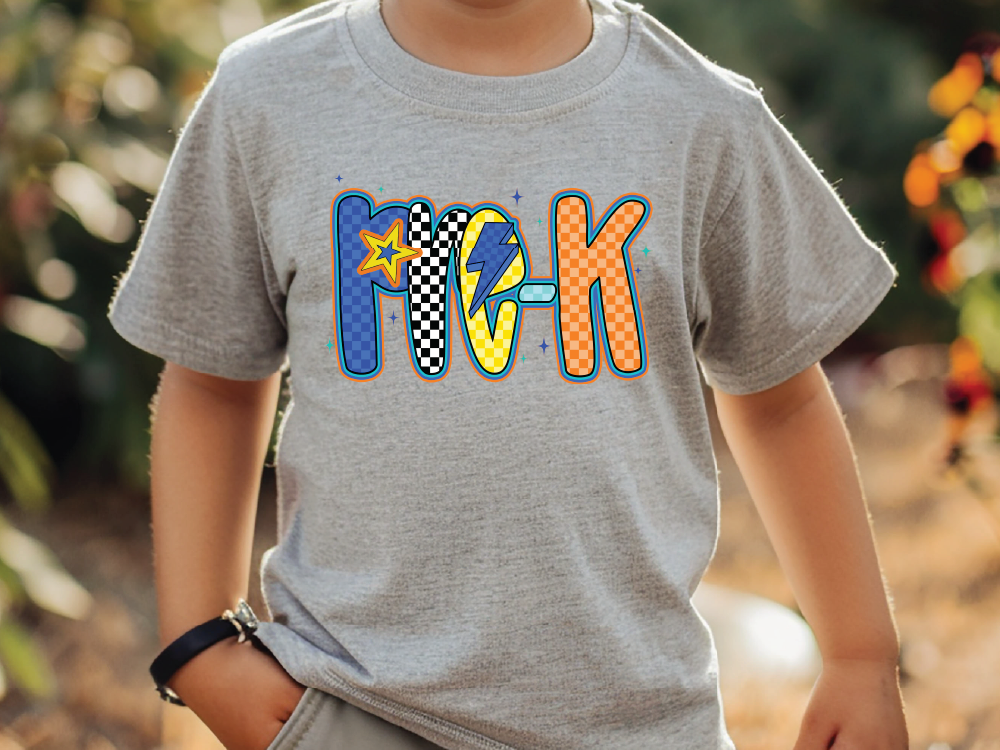 a young boy wearing a gray shirt with the word rock on it