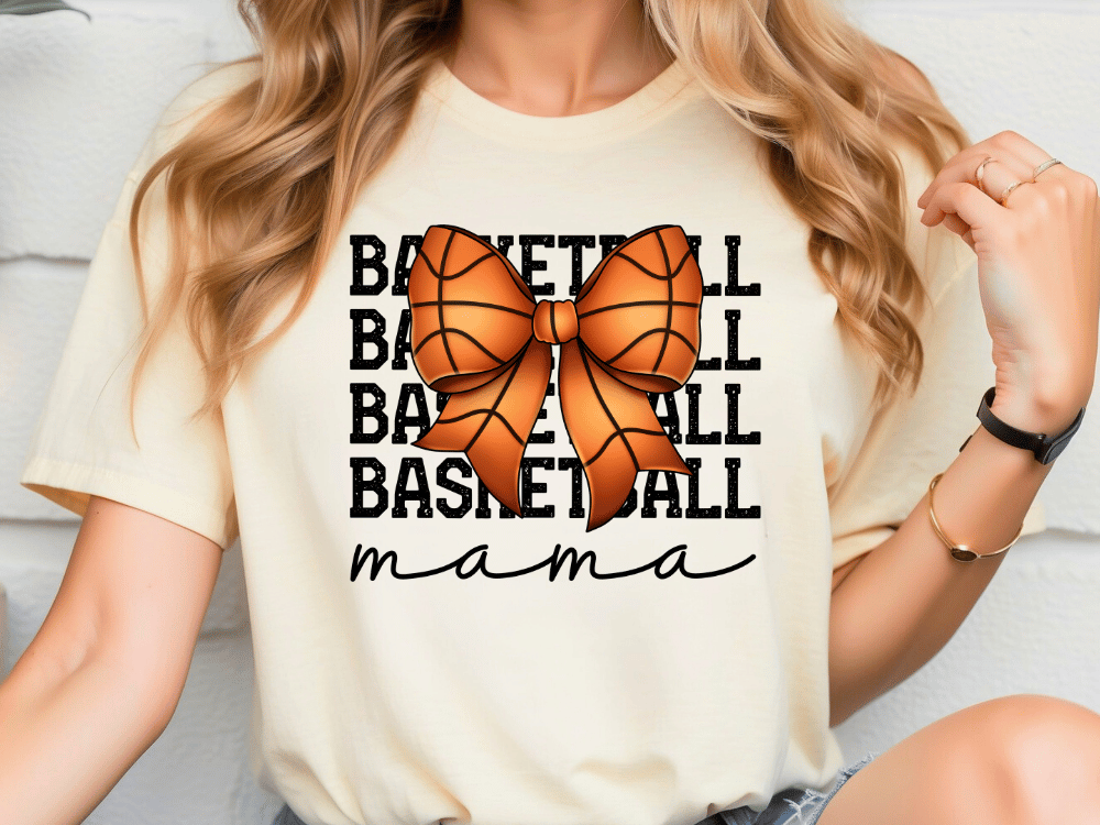 A woman wearing a white t-shirt with a basketball graphic and the word "mama" written below it.