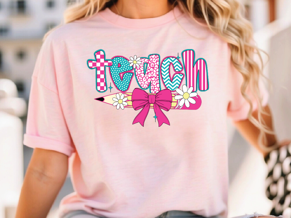 a woman wearing a pink shirt with a pink bow
