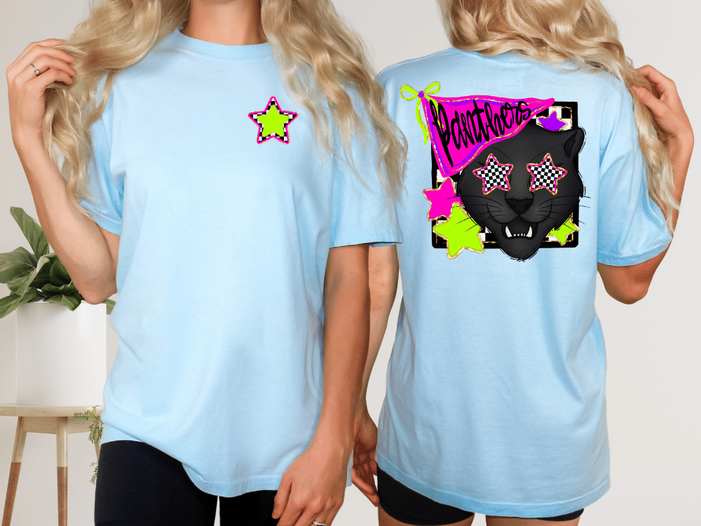 A woman wearing a light blue t-shirt with a graphic design on the back, including a black panther and colorful stars.