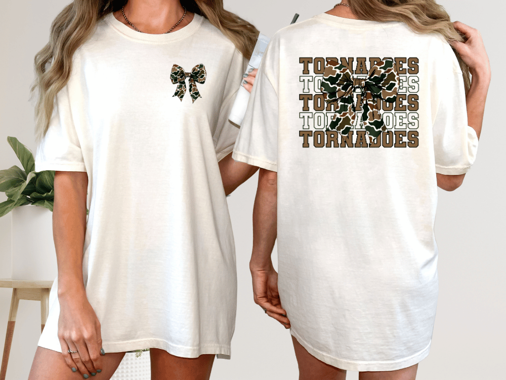 A woman wearing a white t-shirt with a graphic design on the back.