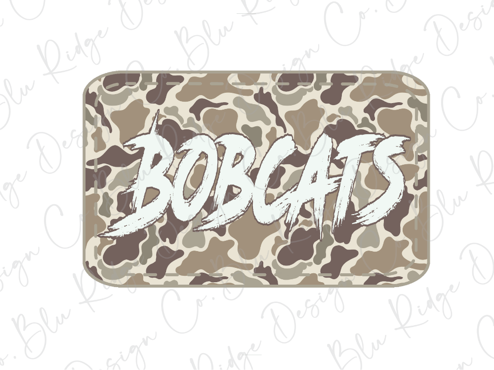 A camouflage-patterned object with the word "BOBCATS" written on it in a stylized font.