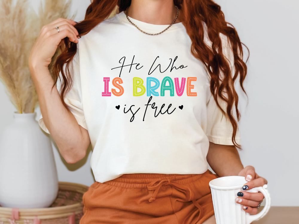 a woman wearing a t - shirt that says he who is brave is true