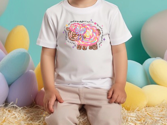 a little boy sitting on a pile of hay
