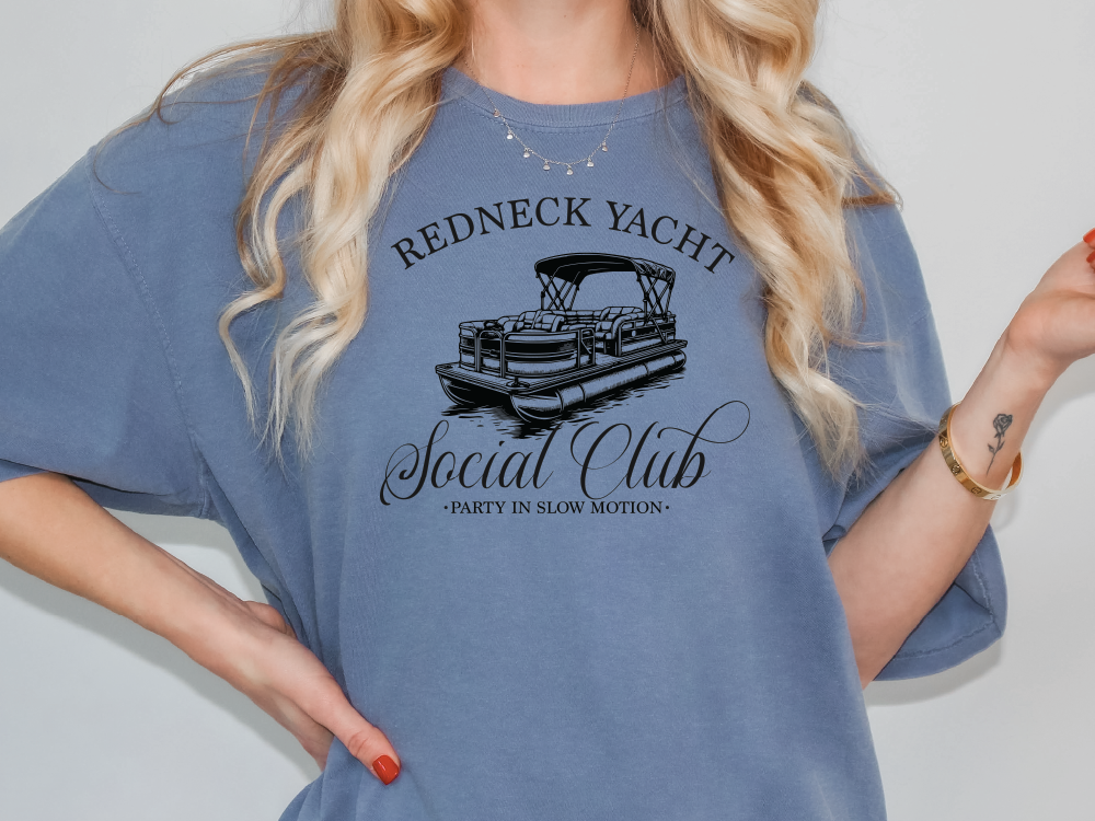 a woman wearing a redneck yacht social club t - shirt