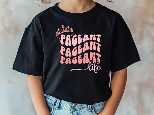 a young girl wearing a black pageant pageant t - shirt
