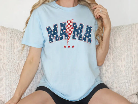 a woman sitting on a couch wearing a blue shirt