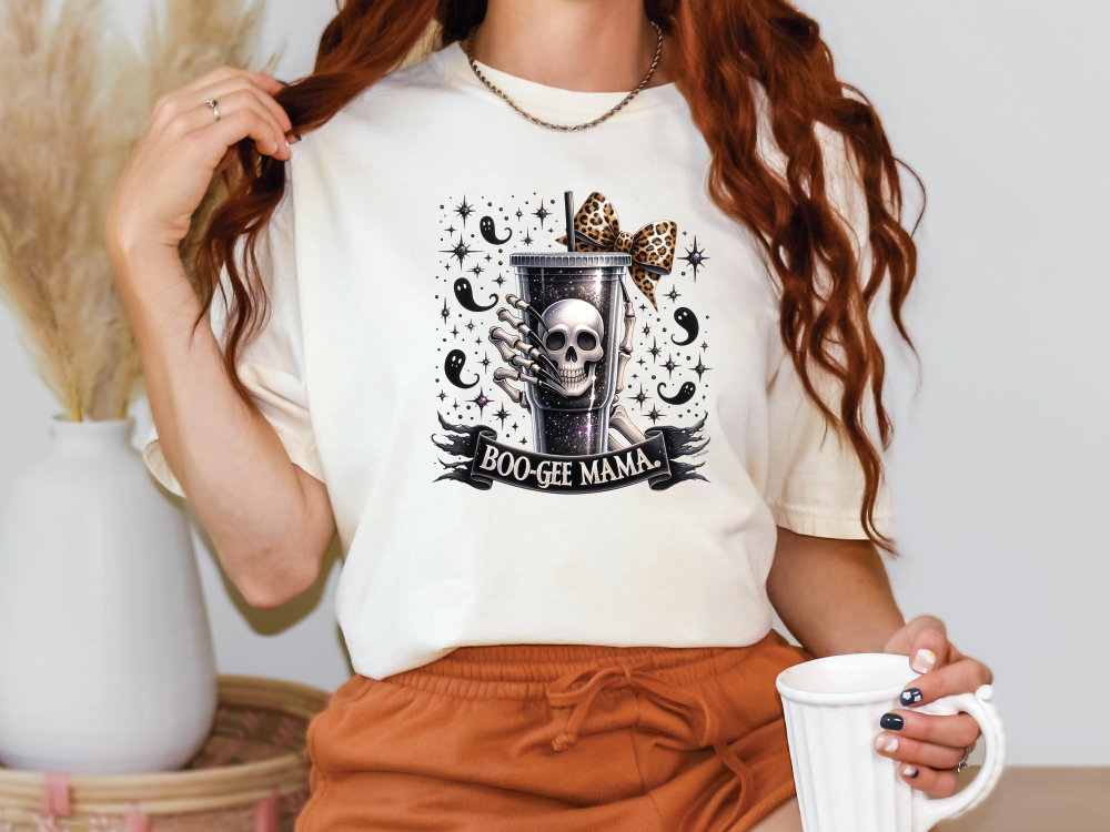 a woman holding a coffee cup and wearing a t - shirt