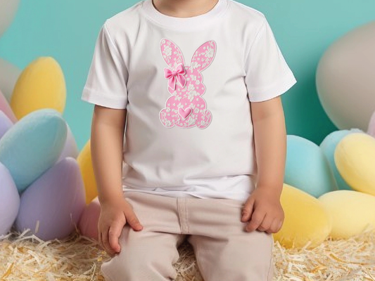 a little girl sitting in front of a bunch of balloons