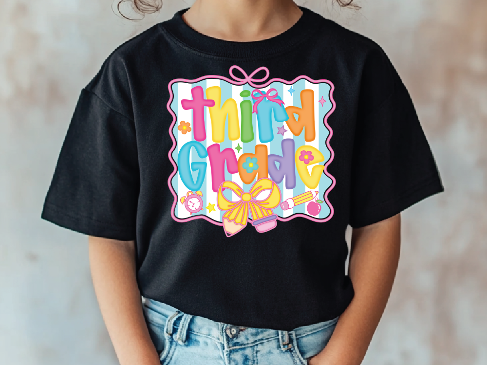 a little girl wearing a black shirt with a bow