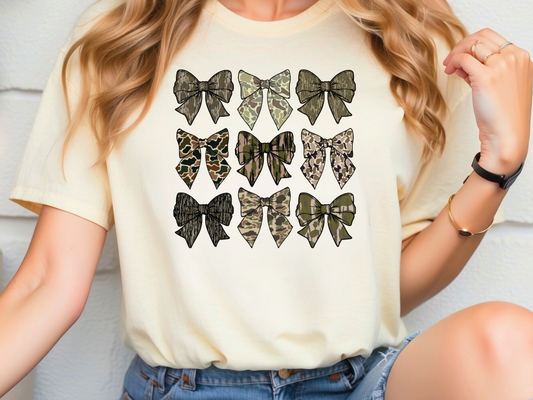 a woman wearing a t - shirt with a bunch of bows on it
