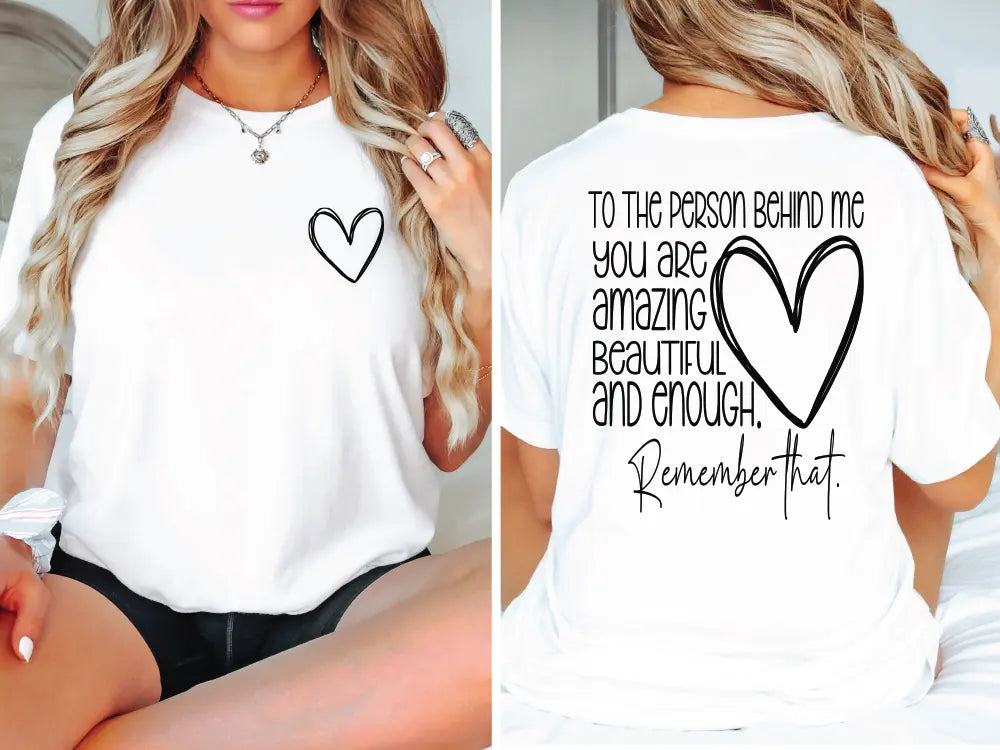 a woman wearing a white shirt with a heart on it