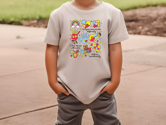 a young boy wearing a t - shirt with a cartoon character on it
