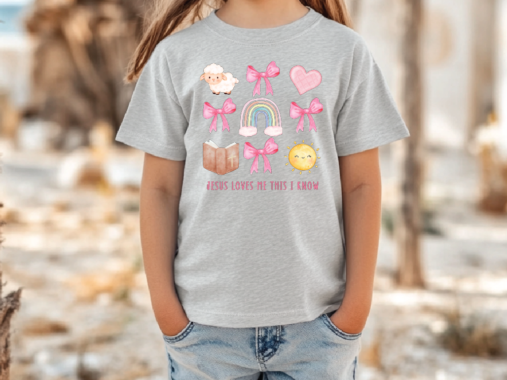 a little girl standing next to a tree