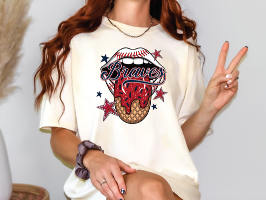 a woman sitting on a chair holding a peace sign