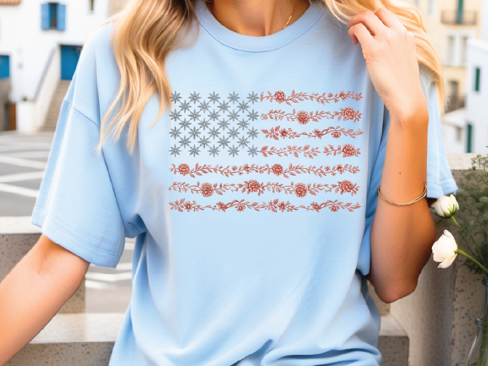 a woman wearing a blue shirt with an american flag on it