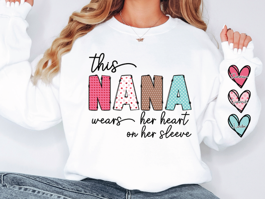 a woman wearing a white shirt that says, this nana wears her heart on