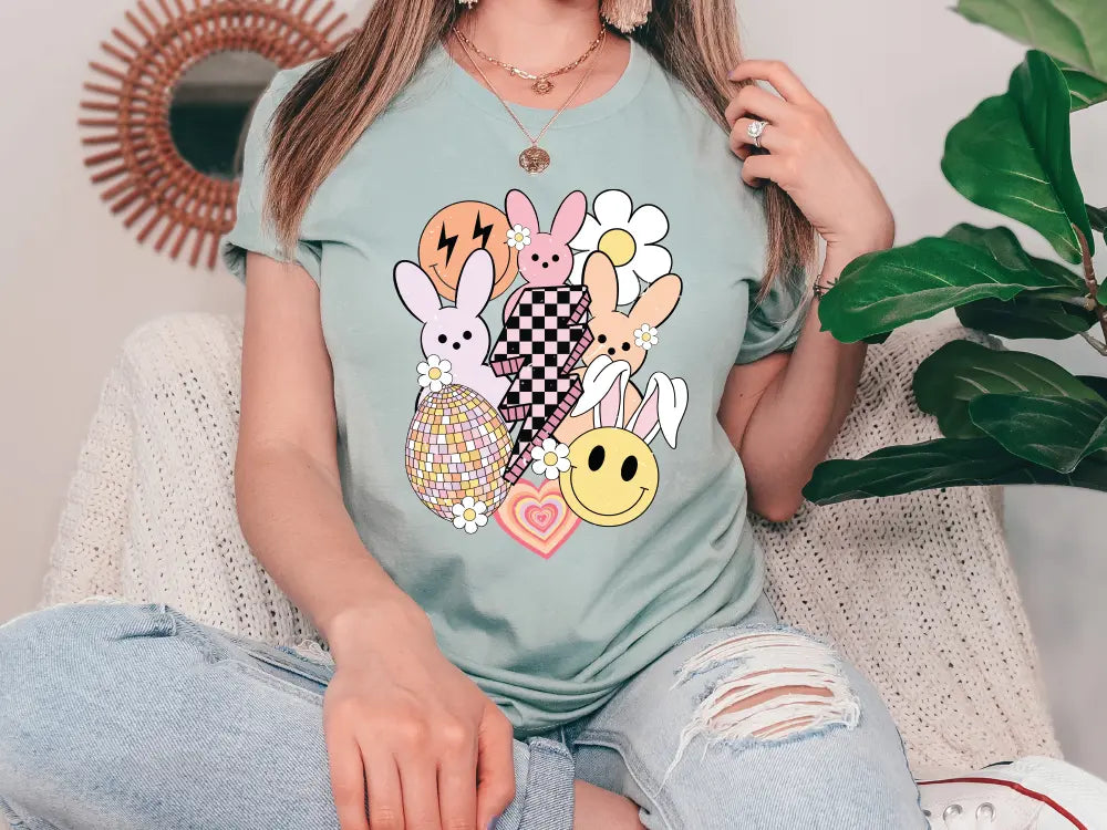 a woman sitting on a couch wearing a t - shirt with cartoon characters on it